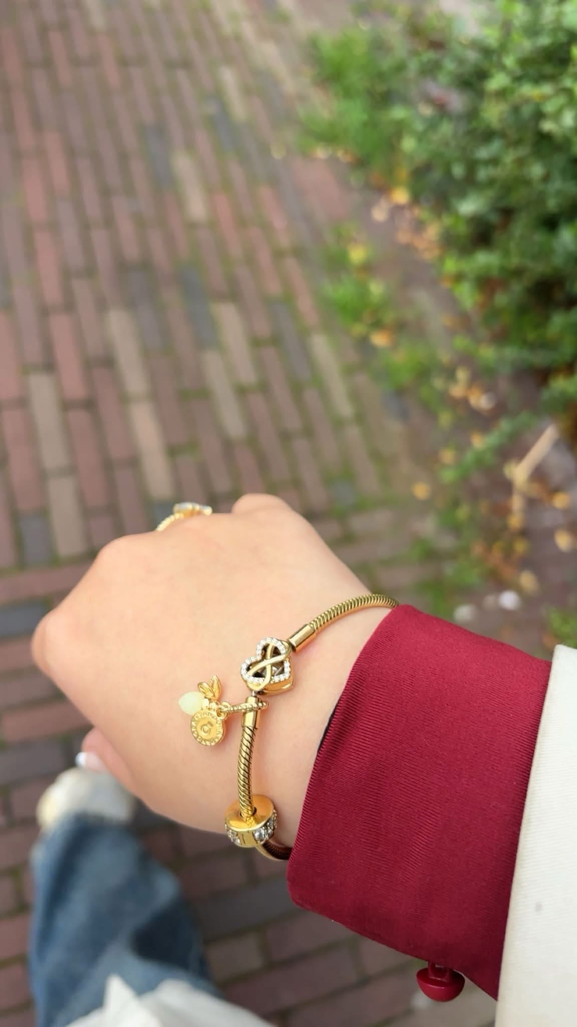 Gold bracelet with glow-in-the-dark firefly charm